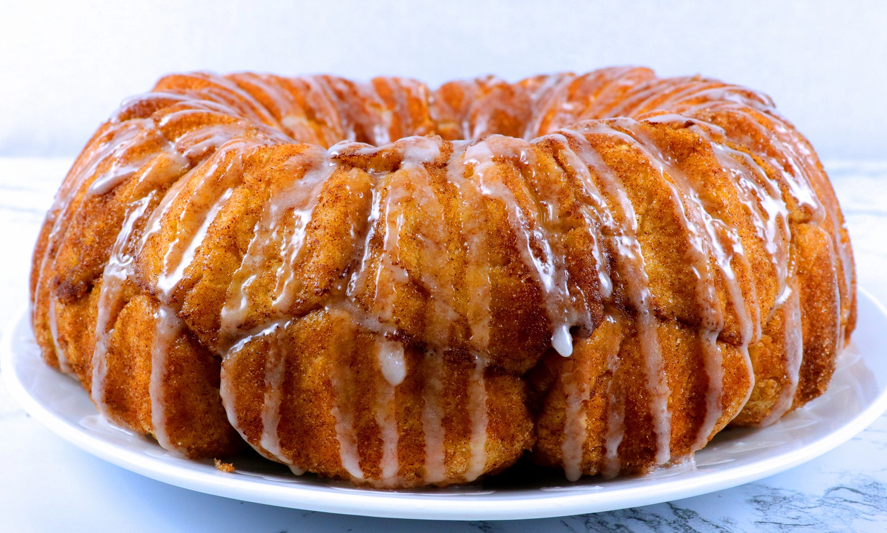 Homemade Monkey Bread on a plate with glaze