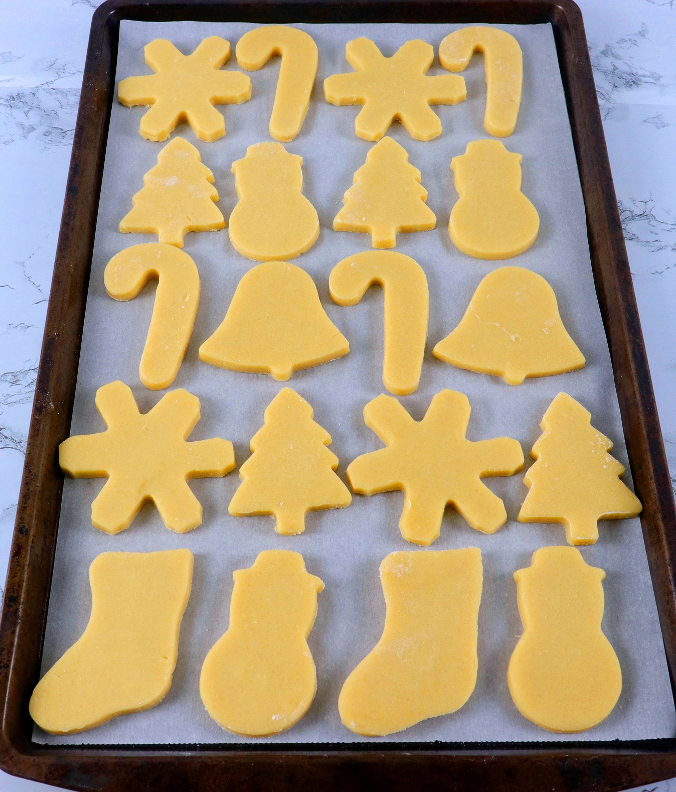 cookie dough shapes on baking pan
