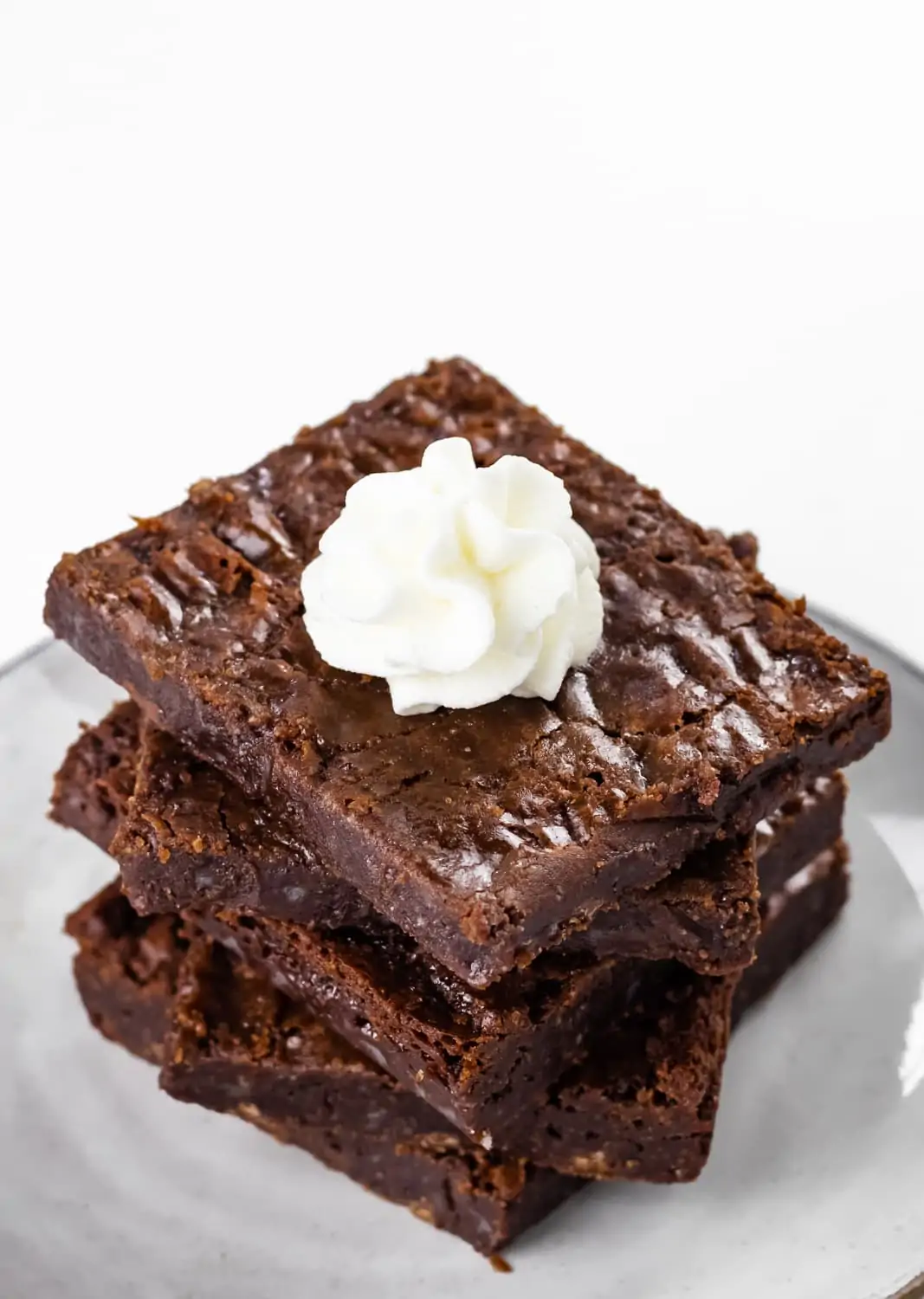 Almond Flour Brownies Stacked with Whipped Cream