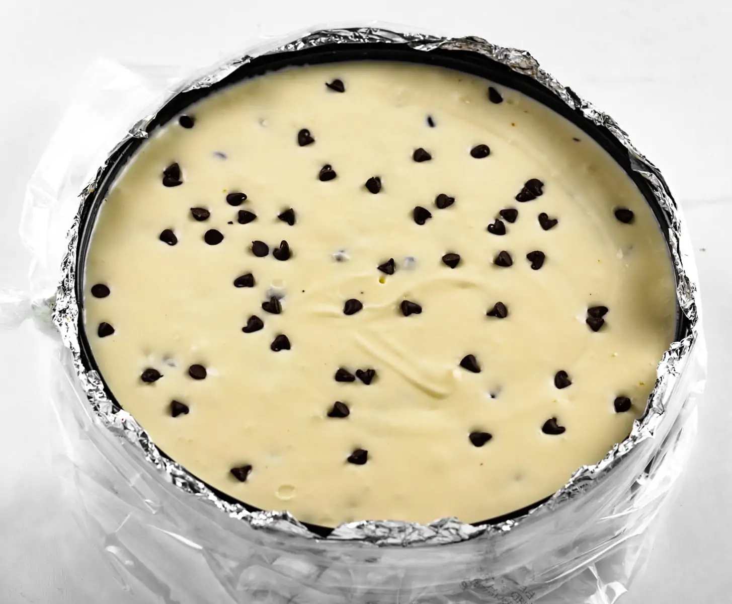 Chocolate Chip Cheesecake Batter in Springform Pan Prebaked