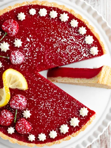 cherry tart with slice on side