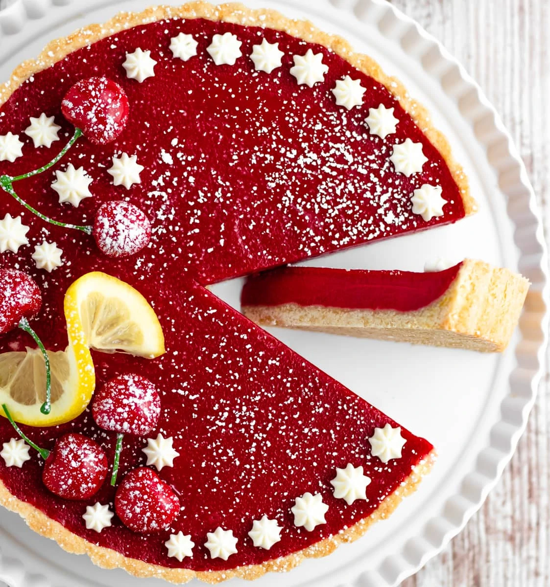 cherry tart with slice on side