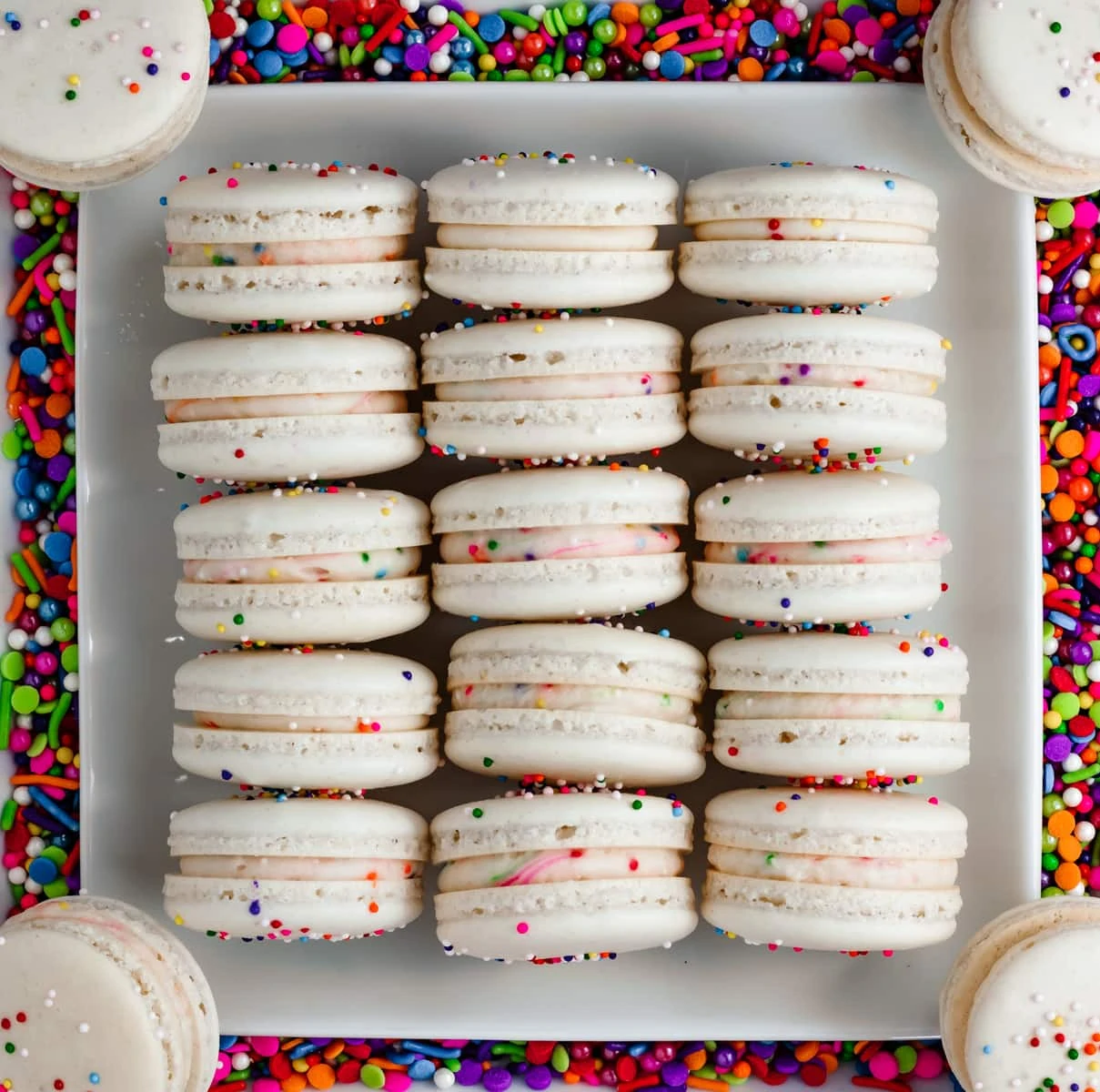 Cake Macarons on a plate with sprinkles