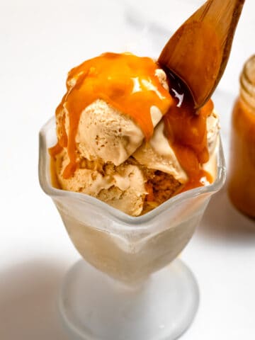 Butterscotch Ice Cream in bowl topped with butterscotch sauce