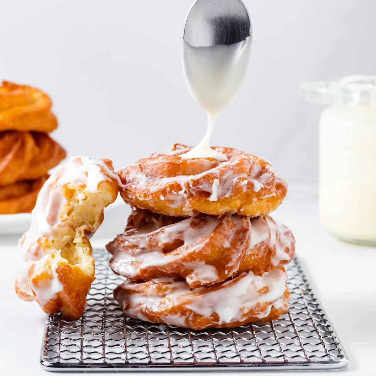 Adding glaze to cruller donuts