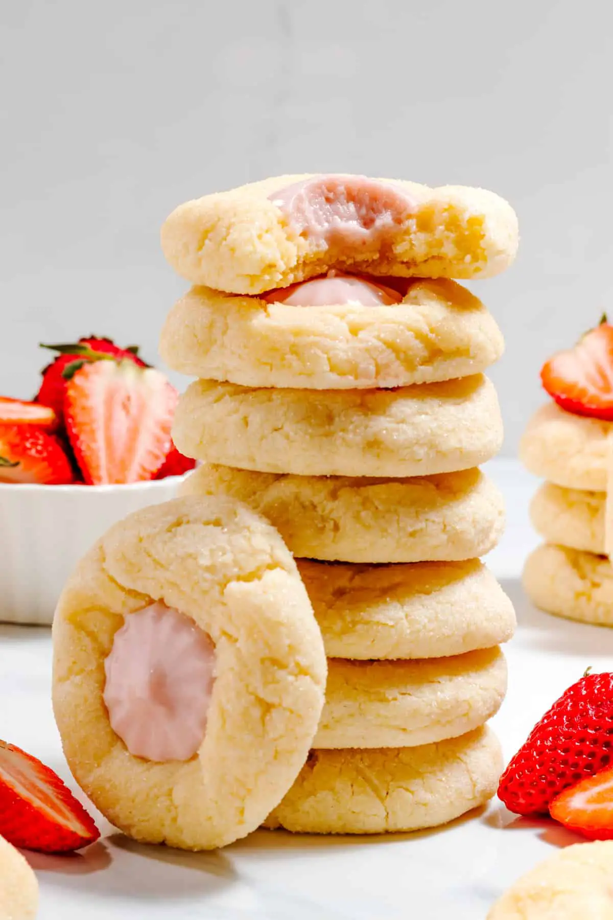 strawberry cheesecake cookies stacked with bite