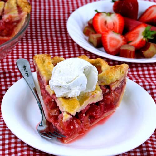 Strawberry rhubarb pie with a scoop of ice cream