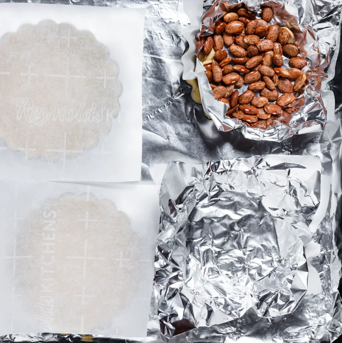 covering tart dough with foil and filling with pie weights