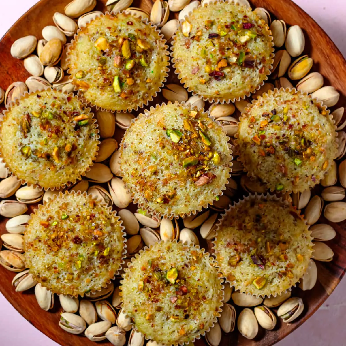 pistachio muffins on plate
