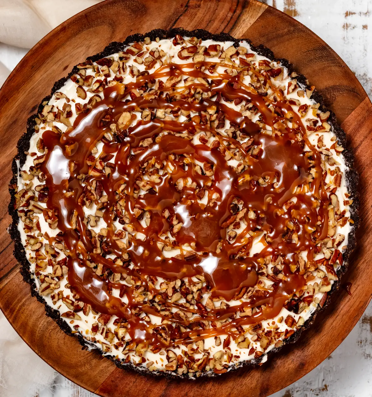 pie filling topped with pecans and caramel